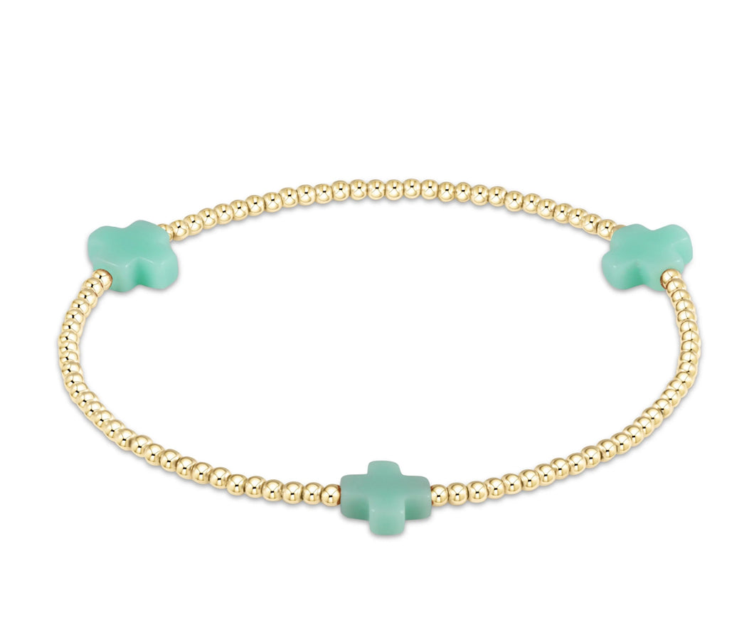 SIGNATURE CROSS GOLD PATTERN 2MM - MINT