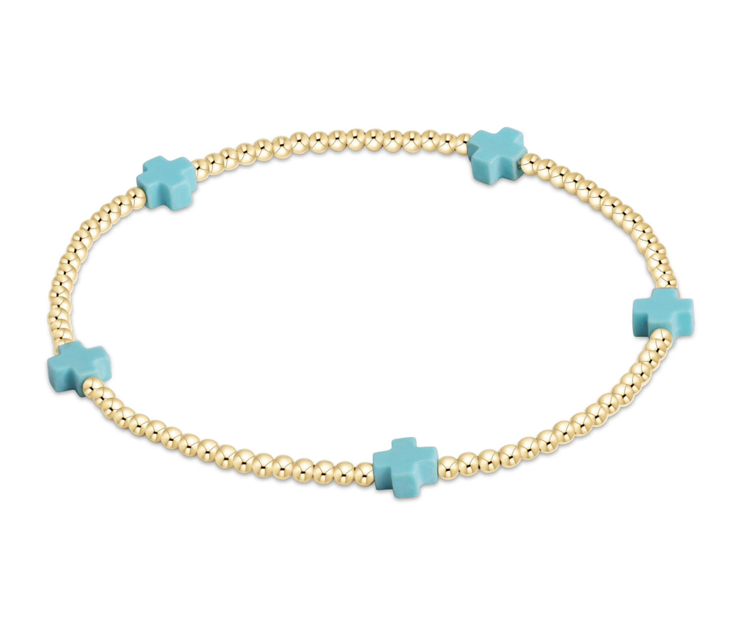 SIGNATURE CROSS SMALL GOLD PATTERN 2MM - TURQUOISE