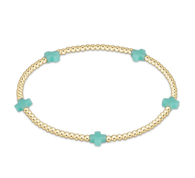 SIGNATURE CROSS SMALL GOLD PATTERN 2MM - MINT