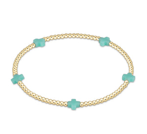 SIGNATURE CROSS SMALL GOLD PATTERN 2MM - MINT