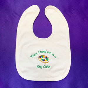 THEY FOUND ME IN A KING CAKE BABY BIB
