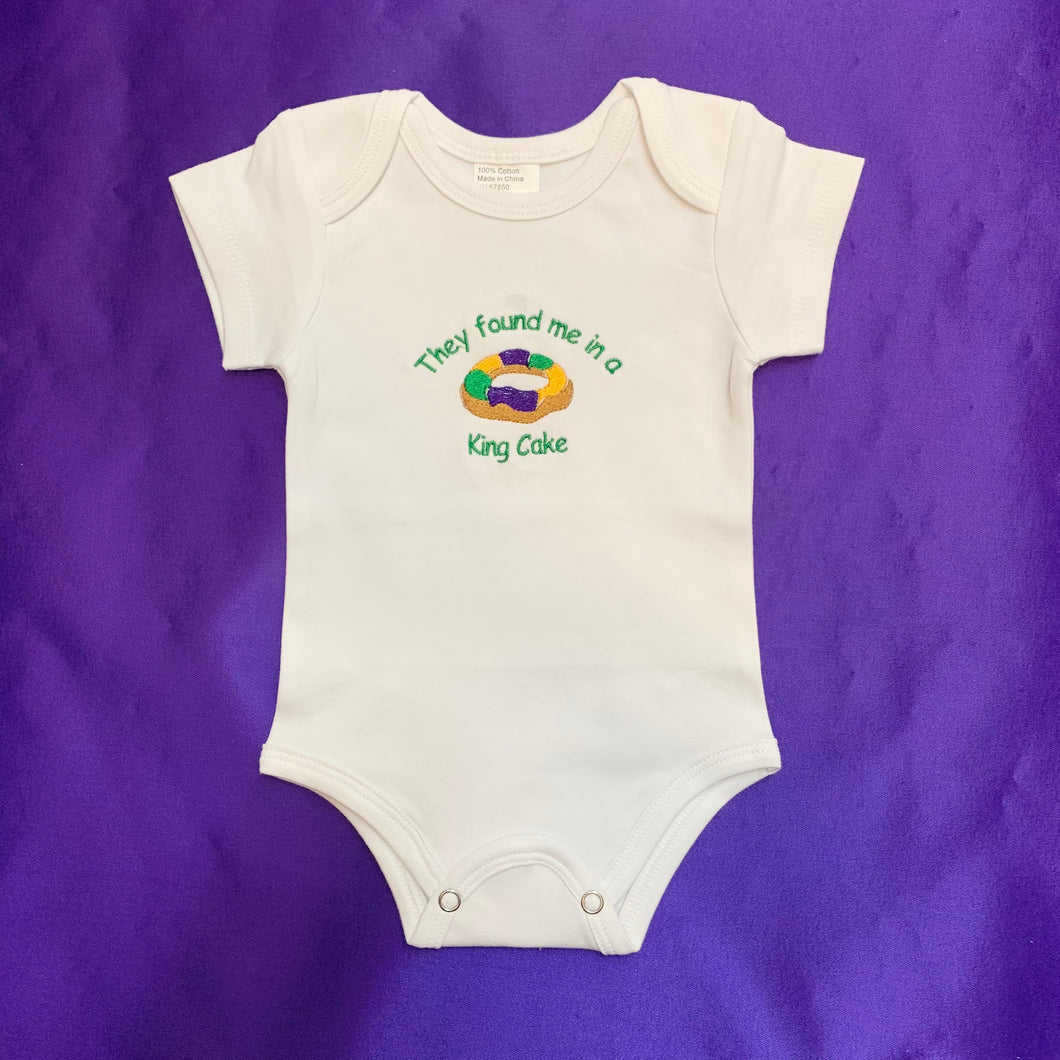 THEY FOUND ME IN A KING CAKE ONESIE 6 MONTH